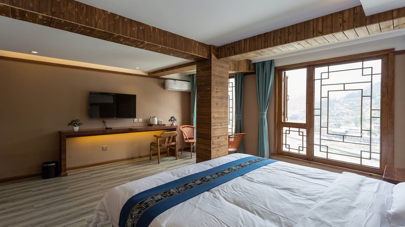 Imagen de la habitación del Hotel Floral Hotel Xijiang Banshan Yunfu. Foto 4