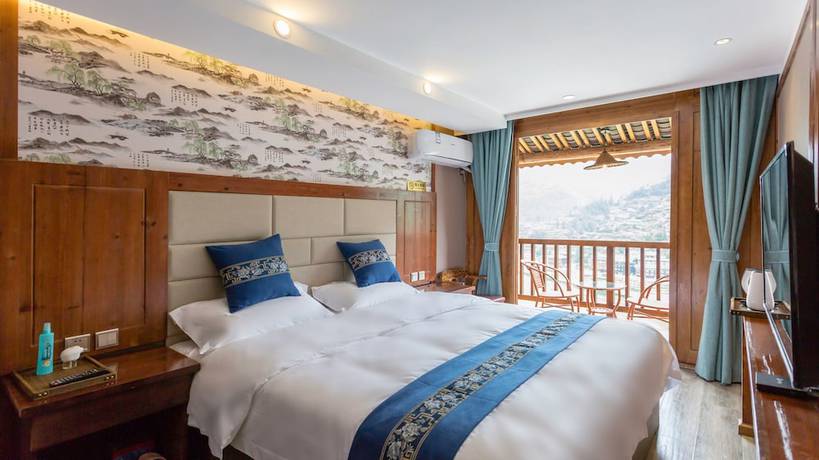 Imagen de la habitación del Hotel Floral Hotel Xijiang Banshan Yunfu. Foto 5