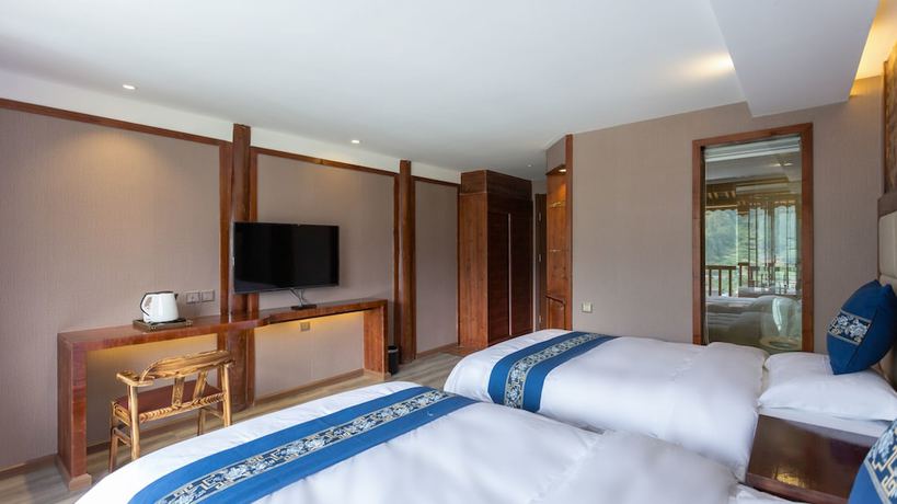 Imagen de la habitación del Hotel Floral Hotel Xijiang Banshan Yunfu. Foto 15