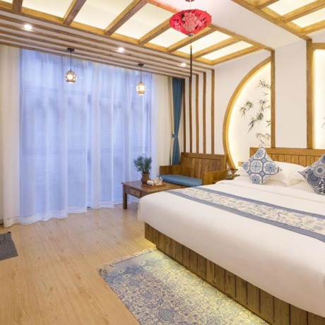 Imagen de la habitación del Hotel Floral Hotel Zhangjiajie Mengqi Meiju. Foto 2