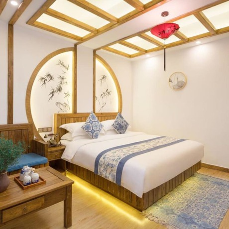 Imagen de la habitación del Hotel Floral Hotel Zhangjiajie Mengqi Meiju. Foto 5