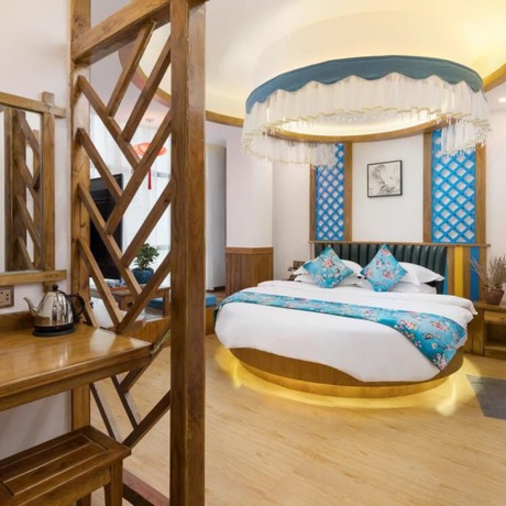 Imagen de la habitación del Hotel Floral Hotel Zhangjiajie Mengqi Meiju. Foto 11