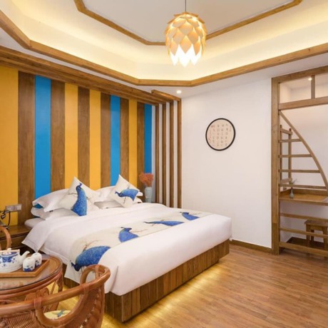 Imagen de la habitación del Hotel Floral Hotel Zhangjiajie Mengqi Meiju. Foto 12