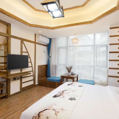 Imagen de la habitación del Hotel Floral Hotel Zhangjiajie Mengqi Meiju. Foto 14
