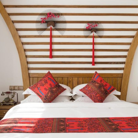 Imagen de la habitación del Hotel Floral Hotel Zhangjiajie Mengqi Meiju. Foto 16