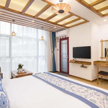 Imagen de la habitación del Hotel Floral Hotel Zhangjiajie Mengqi Meiju. Foto 17