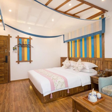 Imagen de la habitación del Hotel Floral Hotel Zhangjiajie Mengqi Meiju. Foto 18