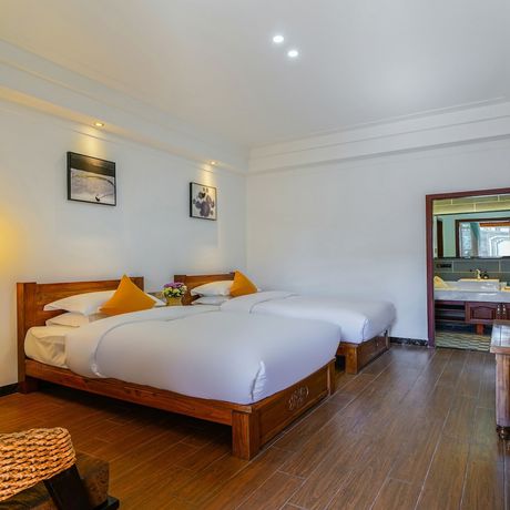 Imagen de la habitación del Hotel Floral Mi Yu Inn Lijiang. Foto 2