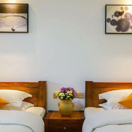 Imagen de la habitación del Hotel Floral Mi Yu Inn Lijiang. Foto 8