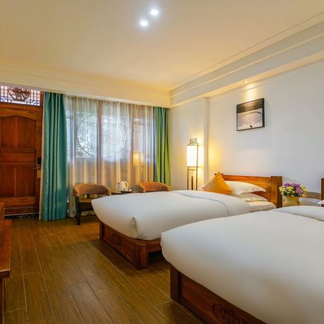 Imagen de la habitación del Hotel Floral Mi Yu Inn Lijiang. Foto 9