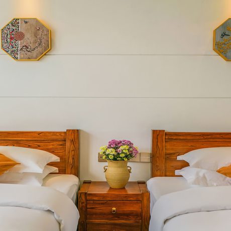 Imagen de la habitación del Hotel Floral Mi Yu Inn Lijiang. Foto 10