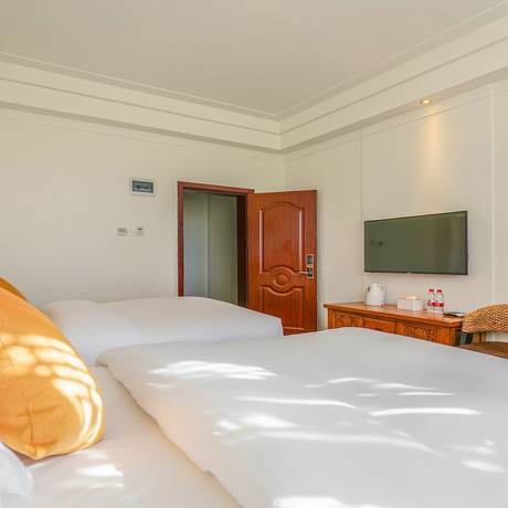 Imagen de la habitación del Hotel Floral Mi Yu Inn Lijiang. Foto 11