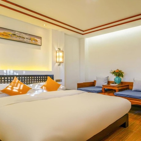 Imagen de la habitación del Hotel Floral Mi Yu Inn Lijiang. Foto 12
