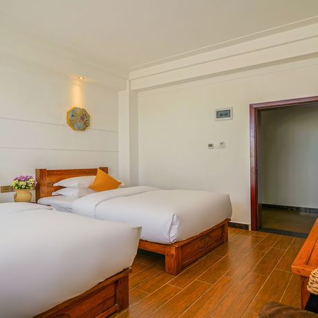 Imagen de la habitación del Hotel Floral Mi Yu Inn Lijiang. Foto 13