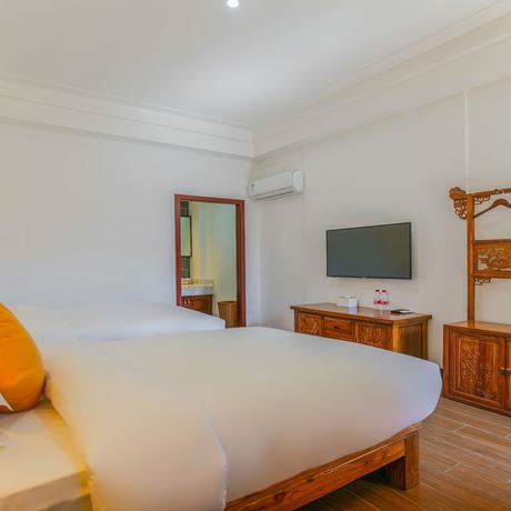 Imagen de la habitación del Hotel Floral Mi Yu Inn Lijiang. Foto 15