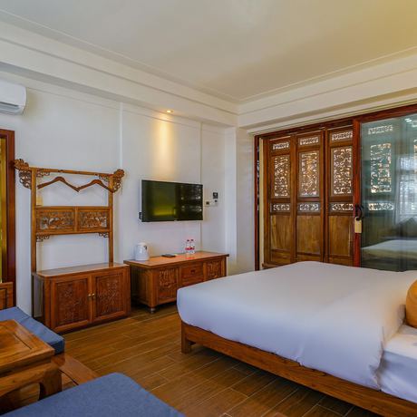 Imagen de la habitación del Hotel Floral Mi Yu Inn Lijiang. Foto 16
