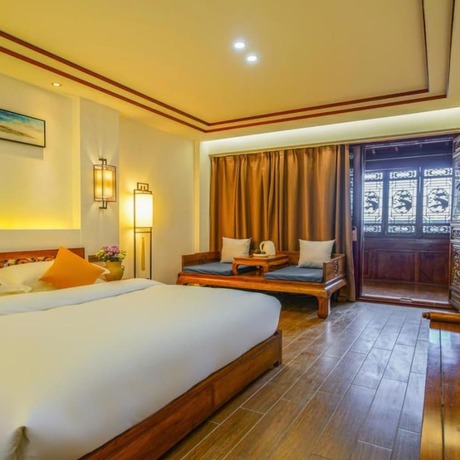 Imagen de la habitación del Hotel Floral Mi Yu Inn Lijiang. Foto 17