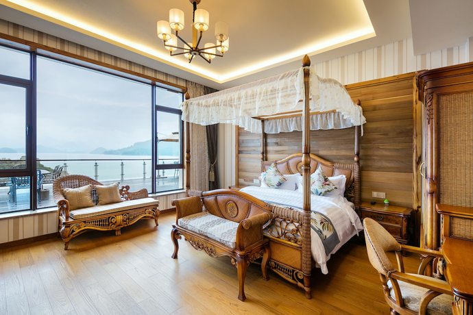 Imagen de la habitación del Hotel Floral Qiandaohu Shangju Villa. Foto 7