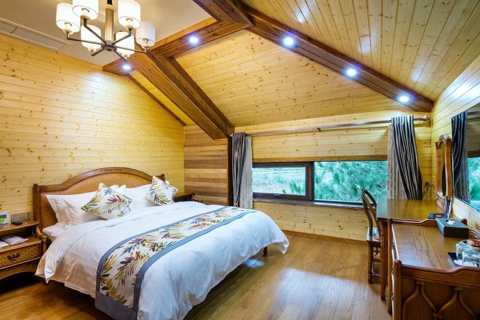 Imagen de la habitación del Hotel Floral Qiandaohu Shangju Villa. Foto 8