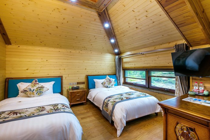 Imagen de la habitación del Hotel Floral Qiandaohu Shangju Villa. Foto 11