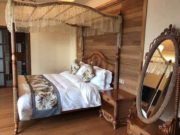 Imagen de la habitación del Hotel Floral Qiandaohu Shangju Villa. Foto 12