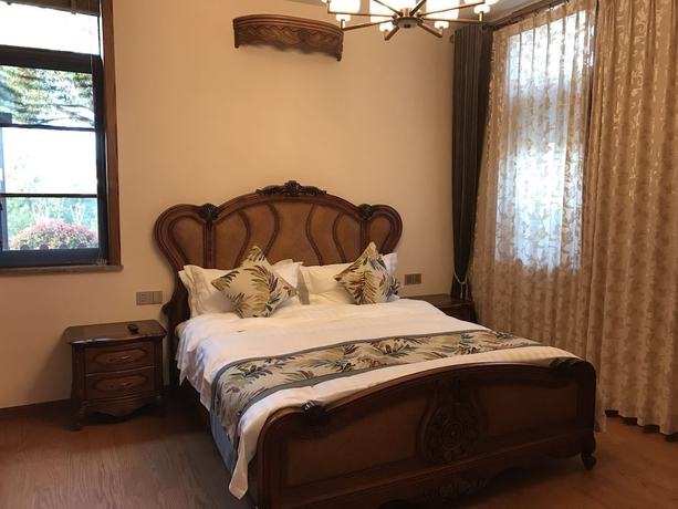 Imagen de la habitación del Hotel Floral Qiandaohu Shangju Villa. Foto 17