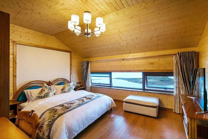 Imagen de la habitación del Hotel Floral Qiandaohu Shangju Villa. Foto 18