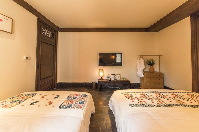 Imagen de la habitación del Hotel Floral Yun Xi Lijiang. Foto 14