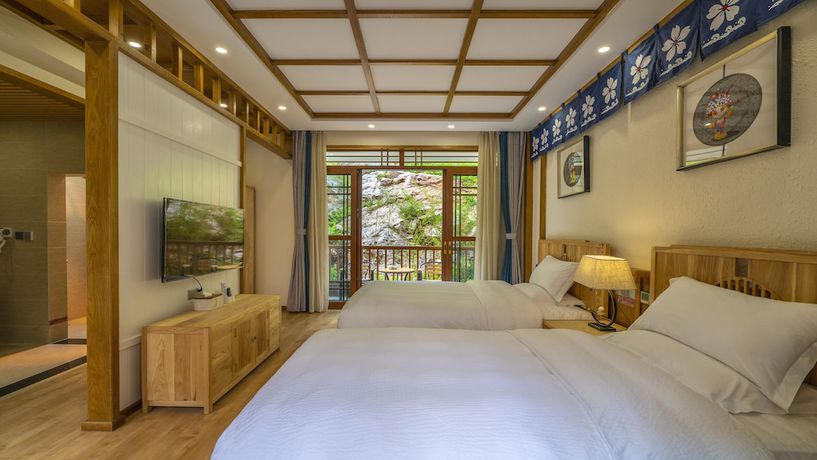 Imagen de la habitación del Hotel Floral &middot; Rushuang Courtyard Lijiang. Foto 10