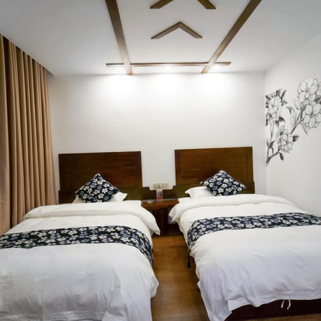 Imagen de la habitación del Hotel Floral &middot; Spring Guesthouse Zhangjiajie. Foto 11