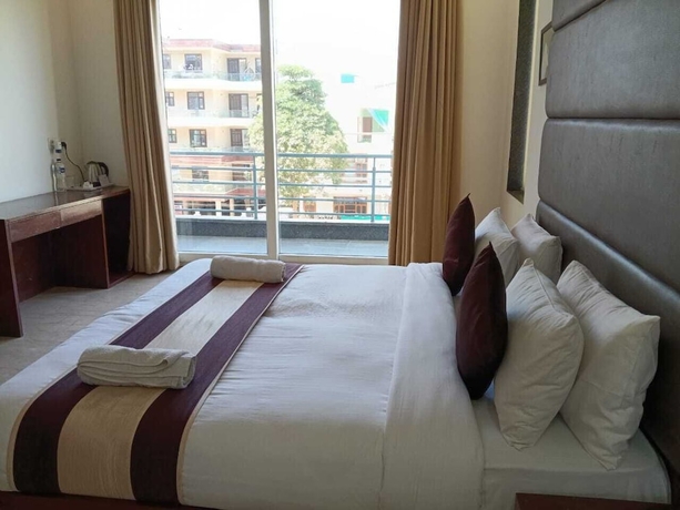 Imagen de la habitación del Hotel Florence and Banquets By Elite Sol. Foto 13