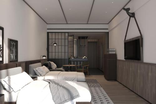 Imagen de la habitación del Hotel Flow and Co. Qingdao, Autograph Collection. Foto 11
