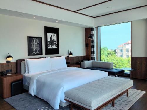 Imagen de la habitación del Hotel Flow and Co. Qingdao, Autograph Collection. Foto 19