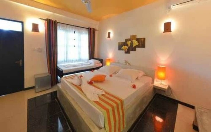 Imagen de la habitación del Hotel Flower Garden Eco Village. Foto 18