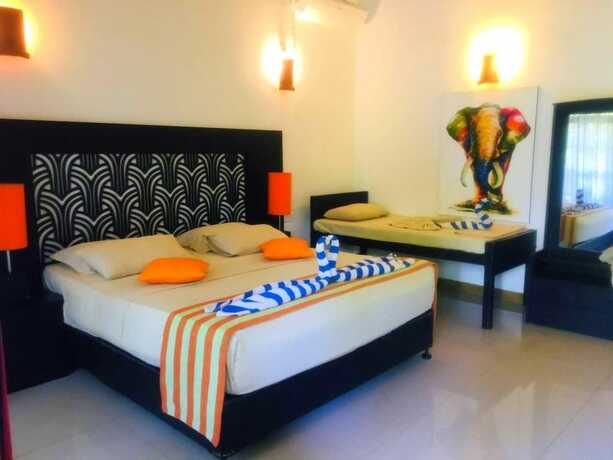 Imagen de la habitación del Hotel Flower Garden Eco Village. Foto 19