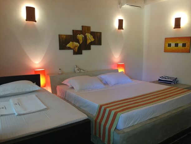 Imagen de la habitación del Hotel Flower Garden Eco Village. Foto 25