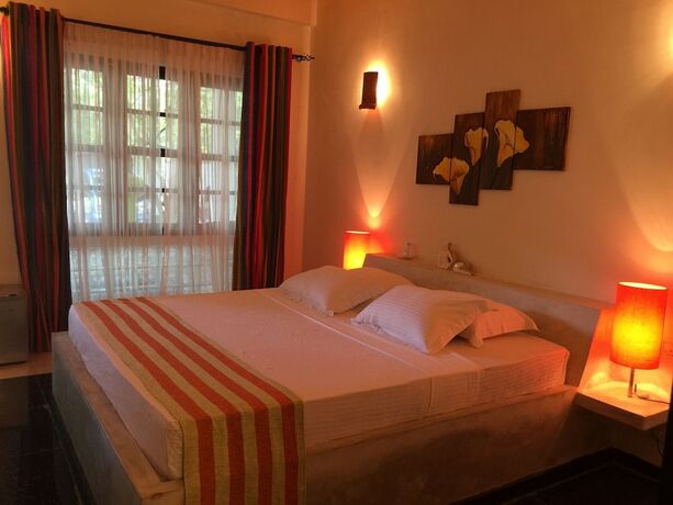 Imagen de la habitación del Hotel Flower Garden Eco Village. Foto 27