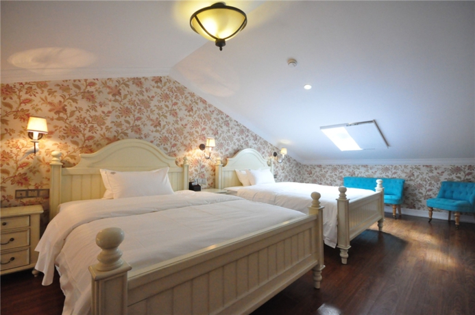 Imagen de la habitación del Hotel Flower Yard Inn Xiamen Gulangyu Anhai Garden Branc. Foto 6