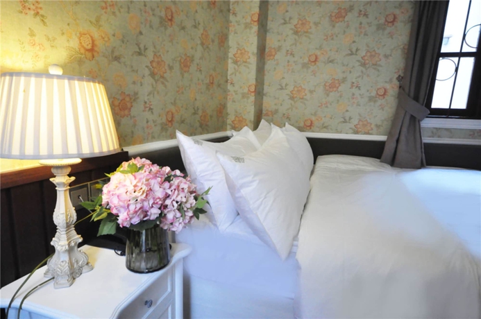 Imagen de la habitación del Hotel Flower Yard Inn Xiamen Gulangyu Anhai Garden Branc. Foto 8