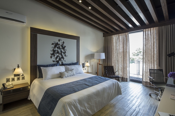 Imagen de la habitación del Hotel Flowsuites Condesa Adults Only. Foto 13