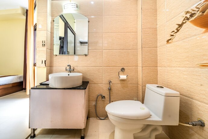 Imagen de la habitación del Hotel Flutters and Resort. Foto 15