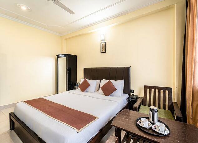 Imagen de la habitación del Hotel Flutters and Resort. Foto 18