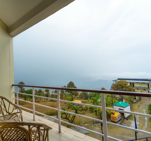 Imagen de la habitación del Hotel Flutters and Resort. Foto 20