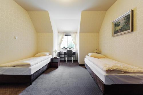 Imagen de la habitación del Hotel Folwark. Foto 6