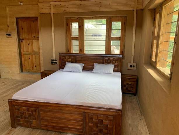 Imagen de la habitación del Hotel Forest View Farmhouse Stay. Foto 10