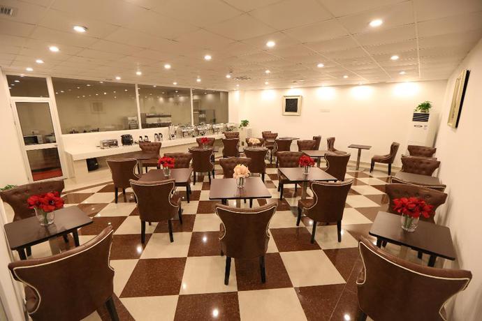 Imagen del bar/restaurante del Hotel Forson International Luxury Hotel Store 1. Foto 2