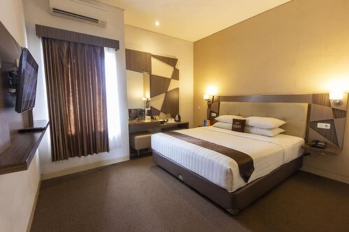 Imagen de la habitación del Hotel FortunaGrande Malioboro. Foto 7