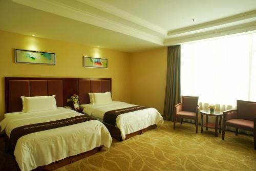 Imagen de la habitación del Hotel Foshan Jiagao Business. Foto 7
