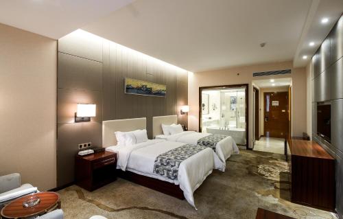 Imagen de la habitación del Hotel Foshan New Junyue International. Foto 5