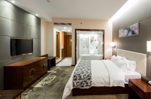 Imagen de la habitación del Hotel Foshan New Junyue International. Foto 6